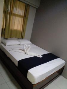 Postel nebo postele na pokoji v ubytování Sunseekers Outrigger Hotel