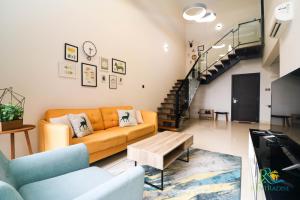 a living room with a couch and a table at VSummer Stylish Loft Suites @ UHA in Johor Bahru