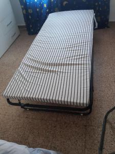 ein weißes Bett auf dem Boden in einem Zimmer in der Unterkunft Room in Guest room - Peaceful accommodation in Madrid near Atocha in Madrid