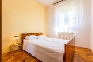 Postel nebo postele na pokoji v ubytování Holiday Home Grande