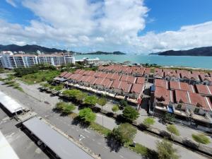 an aerial view of a city with buildings and the water at MAYA SeaView Families Suite Apartment + Sky Pool in Kuah