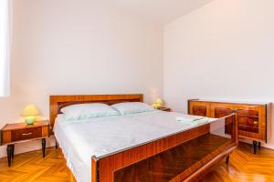 Postel nebo postele na pokoji v ubytování Holiday Home Grande