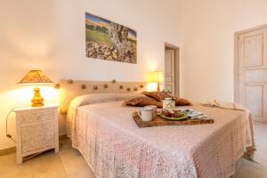 Llit o llits en una habitació de Once upon a time in Masseria Sitamara