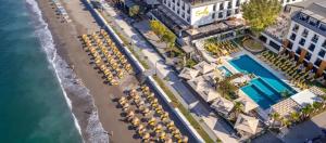 an overhead view of a beach with chairs and umbrellas at Sundia Exclusive By Liberty Fethiye Adults Only in Fethiye