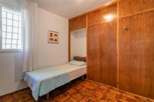 Łóżko lub łóżka w pokoju w obiekcie Casa Blanca 1 direkt am Strand