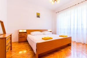 Postel nebo postele na pokoji v ubytování Holiday Home Grande