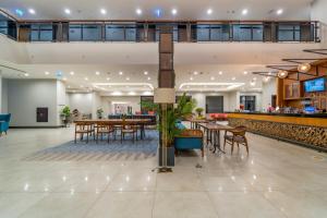 an empty lobby with tables and a bar at Sundia Exclusive By Liberty Fethiye Adults Only in Fethiye