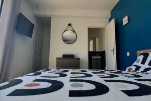 a bedroom with a bed with a carpet on it at Studio Provence in Istres