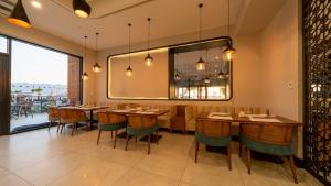 a dining room with a long table and chairs at Sundia Exclusive By Liberty Fethiye Adults Only in Fethiye