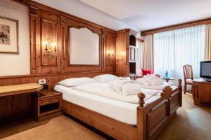 Ein Bett oder Betten in einem Zimmer der Unterkunft VILA VITA Burghotel Dinklage