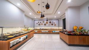 a restaurant with a buffet of food on display at Sundia Exclusive By Liberty Fethiye Adults Only in Fethiye