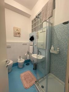 a bathroom with a shower and a sink and a toilet at PALAZZO MARCHETTI in Ancona +23 photos