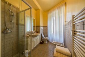 a bathroom with a toilet and a sink and a shower at BED and BIKE - BERGAMO Dream House in Bergamo