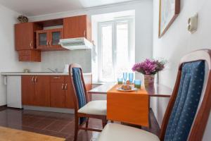 a kitchen and dining room with a table and chairs at Do you want to fully enjoy Old Town in Dubrovnik