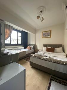Postel nebo postele na pokoji v ubytování Hotel Kent Ani