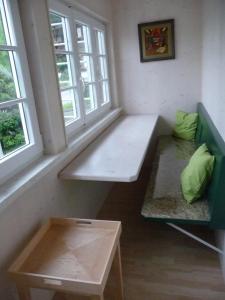 a room with two benches and two windows at Meistereders Ferienwohnung in Schönau am Königssee