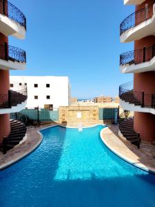 a swimming pool in the middle of a building at Oasis marsa alam in Marsa Alam City