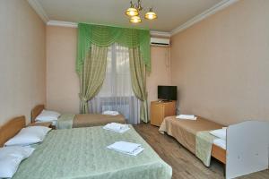 Ένα ή περισσότερα κρεβάτια σε δωμάτιο στο Hotel Sevan