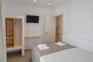 Postel nebo postele na pokoji v ubytování Barbarigos luxury spa apartments