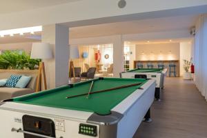 a living room with a pool table at BLUESEA Piscis - Adults Only in Port d'Alcudia