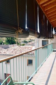 an empty balcony of a building with lights at Santa Brigida - Real 1 in Hontanas