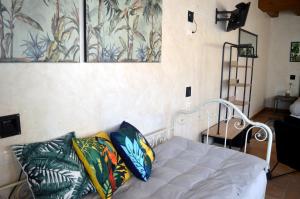 a white bed with pillows on it in a room at Santa Brigida - Real 1 in Hontanas
