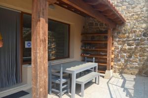 a table on the porch of a house at Santa Brigida - Real 1 in Hontanas