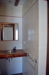 a bathroom with a sink and a mirror at Santa Brigida - Real 1 in Hontanas