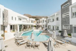 a view of the courtyard of a hotel with a swimming pool at Cyano Hotel in Plakias