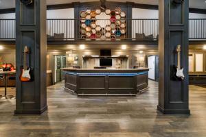 a large kitchen with a large island in the middle at Hillside Crossing Nashville a Ramada by Wyndham in Nashville