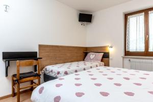 Postel nebo postele na pokoji v ubytování Dimora La Val