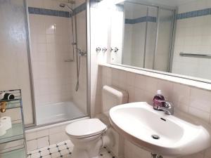 Ванна кімната в Sylter-Besserburg-App-6