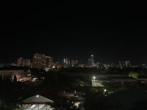 a night view of a city with lights at Luxanos Condo Place- San Marino in Cebu City