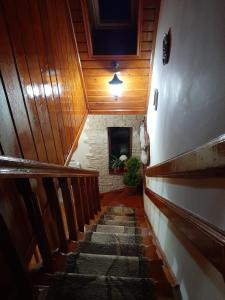 a staircase in a house with wooden ceilings at Family Home in Cheia