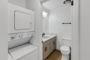 a bathroom with a toilet and a sink and a mirror at Beautiful Ski-in Ski-out Condo Located On The Eagle Point Resort! condo in Beaver
