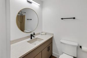 a bathroom with a sink and a mirror at Beautiful Ski-in Ski-out Condo Located On The Eagle Point Resort! condo in Beaver