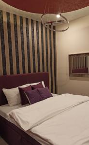 Ένα ή περισσότερα κρεβάτια σε δωμάτιο στο Apartmani President IV