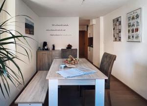 a dining room table with a bowl of fruit on it at Ferienwohnung Ortsmitte in Hilders