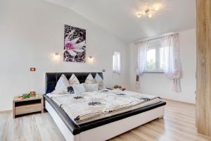 Postel nebo postele na pokoji v ubytování Villa Brcina