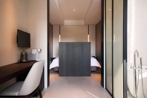 Lova arba lovos apgyvendinimo įstaigoje Manho Hotel