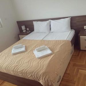 Postelja oz. postelje v sobi nastanitve New apartment located in the heart of Niksic.