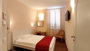 Postel nebo postele na pokoji v ubytování Hotel Rita Major