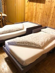 Postel nebo postele na pokoji v ubytování Hotel Flora Alpina