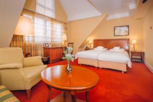 Postel nebo postele na pokoji v ubytování Hotel Moosburger Hof