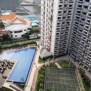 an overhead view of a swimming pool in a city at Solemare Parksuites Condo in Manila