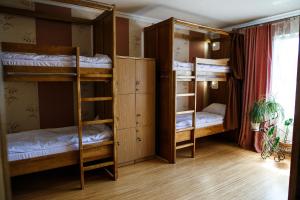 a room with bunk beds in a hostel at Sweet Home Hostel in Chernivtsi