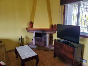 TV a/nebo společenská místnost v ubytování Villa Peregrina