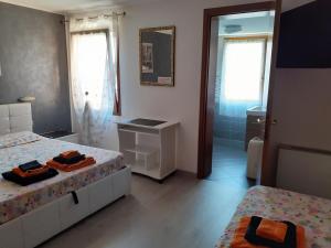 Postel nebo postele na pokoji v ubytování B&B Casa Taty