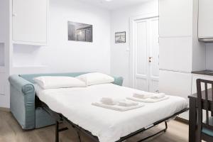 Posteľ alebo postele v izbe v ubytovaní Prestige Boutique Homes - Navigli