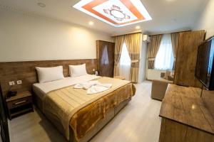 A bed or beds in a room at Zin Hotel İstanbul